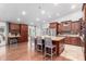 Spacious kitchen with wood cabinets, granite countertops, an island with seating, and stainless-steel appliances at 10105 E Larkspur Dr, Scottsdale, AZ 85260