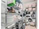 Well-organized pantry features ample shelving for storage and various kitchen appliances at 10105 E Larkspur Dr, Scottsdale, AZ 85260