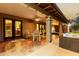 Covered patio featuring tile floors and an outdoor dining area at 10105 E Larkspur Dr, Scottsdale, AZ 85260