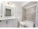 This remodeled bathroom features a sleek vanity and updated shower-tub combo at 11047 N Coggins Dr, Sun City, AZ 85351