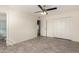 This bright bedroom features wood-look flooring and a ceiling fan for added comfort at 11047 N Coggins Dr, Sun City, AZ 85351