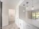 Stylish kitchen featuring stainless steel appliances, pendant lighting, and an open floor plan at 11047 N Coggins Dr, Sun City, AZ 85351