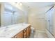 Bathroom with a double sink vanity, shower over tub, and neutral tile floor at 1186 E Bradstock Way, San Tan Valley, AZ 85140