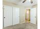 Bedroom with large closet and neutral colors, features carpet and a ceiling fan at 1186 E Bradstock Way, San Tan Valley, AZ 85140