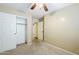 Bedroom with carpet, a ceiling fan, closet with sliding doors, and access to the hall at 1186 E Bradstock Way, San Tan Valley, AZ 85140