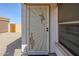 View of security screen door with southwestern themed decorative art at 1186 E Bradstock Way, San Tan Valley, AZ 85140