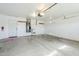 Spacious garage interior with water heater, sink, and garage door with opener at 1186 E Bradstock Way, San Tan Valley, AZ 85140