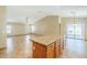 View of kitchen leading into spacious living room with lots of sunlight at 1186 E Bradstock Way, San Tan Valley, AZ 85140