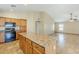 Open concept kitchen with center island and stainless steel appliances at 1186 E Bradstock Way, San Tan Valley, AZ 85140