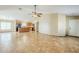 Open-concept living room with tiled floors leading into the kitchen area at 1186 E Bradstock Way, San Tan Valley, AZ 85140