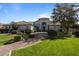 Charming home with landscaped front yard, lush lawn, and inviting entrance at 11869 E Gold Dust Ave, Scottsdale, AZ 85259