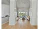 Bright living room with hardwood floors, decorative pillars and natural light at 11869 E Gold Dust Ave, Scottsdale, AZ 85259