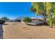 Expansive backyard featuring mature trees and ample space for outdoor activities at 14201 N 103Rd Ave, Sun City, AZ 85351