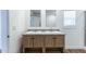 Bathroom featuring a double sink vanity with wood cabinets and marbled countertops at 1426 E 19Th Ave, Apache Junction, AZ 85119