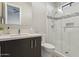 Elegant bathroom with a white tiled shower, dark wood vanity, and modern fixtures for a luxurious feel at 15921 E Ridgestone Dr, Fountain Hills, AZ 85268