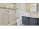Modern bathroom featuring a glass enclosed shower, white tiled walls, and a sleek, floating vanity at 15921 E Ridgestone Dr, Fountain Hills, AZ 85268