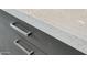 Close-up of the speckled quartz countertop with sleek, modern cabinet hardware at 15921 E Ridgestone Dr, Fountain Hills, AZ 85268