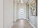 Bright foyer with gray tile flooring, white trim, and contemporary decor at 15921 E Ridgestone Dr, Fountain Hills, AZ 85268