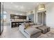 Spacious living room adjacent to kitchen with modern lighting fixtures at 15921 E Ridgestone Dr, Fountain Hills, AZ 85268