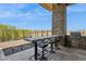 A stunning outdoor kitchen with a built-in grill, bar seating, and picturesque views of the surrounding landscape at 15921 E Ridgestone Dr, Fountain Hills, AZ 85268