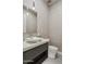 Contemporary powder room featuring textured wallpaper, modern fixtures, and a stylish vessel sink at 15921 E Ridgestone Dr, Fountain Hills, AZ 85268