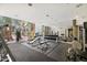 Bright gym with weightlifting machines and dumbbells, plus large mirrors and windows at 1701 E Colter St # 226, Phoenix, AZ 85016