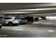 Spacious parking garage with clearly marked spaces and ample lighting at 1701 E Colter St # 226, Phoenix, AZ 85016
