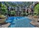 Enjoy the large community pool, surrounded by lush palm trees and manicured landscaping at 1701 E Colter St # 226, Phoenix, AZ 85016