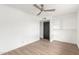 This bedroom offers a neutral color palette, hardwood floors and a ceiling fan at 1713 E Westchester Dr, Tempe, AZ 85283
