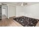 Clean bedroom showcasing wood-look floors, neutral paint, and lots of space at 1713 E Westchester Dr, Tempe, AZ 85283