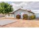 Charming single-story home with a neutral color palette and desert landscaping at 1713 E Westchester Dr, Tempe, AZ 85283