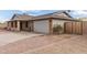 Exterior view of home showing attached garage, driveway, and landscaping at 1713 E Westchester Dr, Tempe, AZ 85283