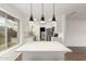 Modern kitchen featuring white countertops, stainless steel appliances, and stylish pendant lights at 1713 E Westchester Dr, Tempe, AZ 85283