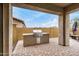 Outdoor BBQ area featuring a built-in grill and brick pavers, perfect for outdoor cooking and entertaining at 1752 N Harper --, Mesa, AZ 85207