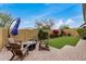 Inviting backyard featuring brick pavers, a cozy fire pit, and comfortable seating for outdoor gatherings at 1752 N Harper --, Mesa, AZ 85207