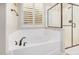 Bright bathroom showcasing a modern tub and a glass-enclosed shower at 1752 N Harper --, Mesa, AZ 85207