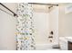 Bathroom featuring tub and shower with decorative dinosaur shower curtain at 1752 N Harper --, Mesa, AZ 85207