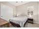 Cozy bedroom featuring carpet, a window with shutters, and a spacious closet with modern white doors at 1752 N Harper --, Mesa, AZ 85207