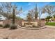 Welcoming entrance to Mountain Bridge Owners Club with desert landscaping and stone signage at 1752 N Harper --, Mesa, AZ 85207