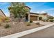 Attractive single-Gathering home featuring stone accents, a two-car garage, and desert-friendly landscaping at 1752 N Harper --, Mesa, AZ 85207