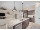Stylish kitchen with stainless steel appliances, a granite island with seating, and open layout at 1752 N Harper --, Mesa, AZ 85207
