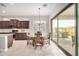 Bright kitchen with stainless steel appliances, granite countertops, and sliding doors leading to the outdoor area at 1752 N Harper --, Mesa, AZ 85207