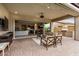 Beautiful covered patio that seamlessly connects indoor and outdoor living spaces featuring brick pavers at 1752 N Harper --, Mesa, AZ 85207