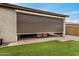 Covered patio with a roll down shade for privacy and comfort; great for enjoying the backyard at 1752 N Harper --, Mesa, AZ 85207