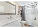 Bright bathroom with a bathtub, shower, modern vanity with marble countertop, and industrial shelving at 1811 W Joy Ranch Rd, Phoenix, AZ 85086