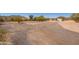 Wide, expansive lot with native desert trees and a view of distant mountains at 1811 W Joy Ranch Rd, Phoenix, AZ 85086