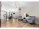 Bright living space featuring modern gray armchairs and a view of the dining area at 1811 W Joy Ranch Rd, Phoenix, AZ 85086