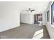 Empty bright and airy bedroom featuring sliding glass doors and neutral decor at 2014 S Archer Cir, Mesa, AZ 85209