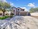 Charming two-story home with a three car garage and well-manicured front yard at 2014 S Archer Cir, Mesa, AZ 85209