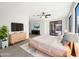 Bright and airy main bedroom featuring sliding glass doors and neutral decor at 2014 S Archer Cir, Mesa, AZ 85209